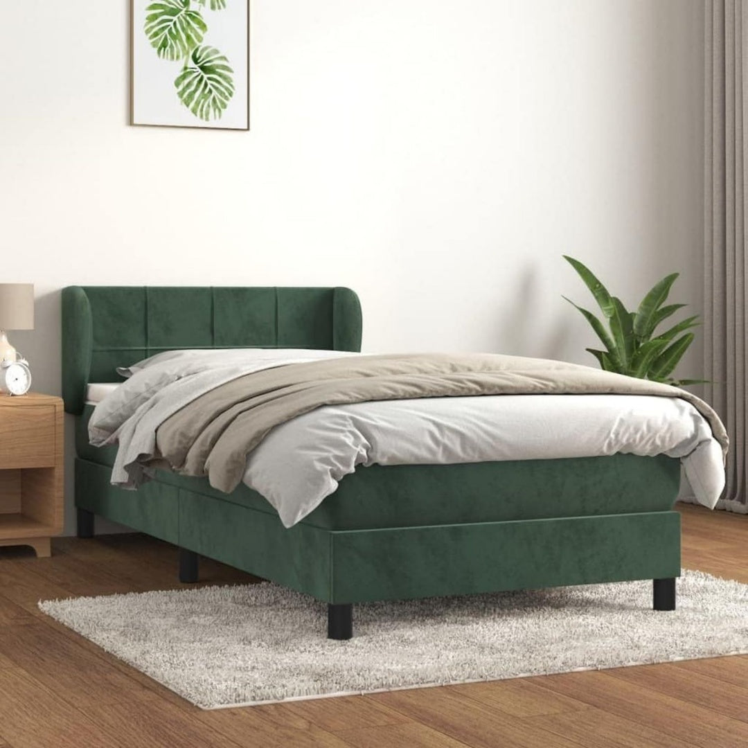 Das Boxspringbett zeigt Hoehenverstellung in Gruen